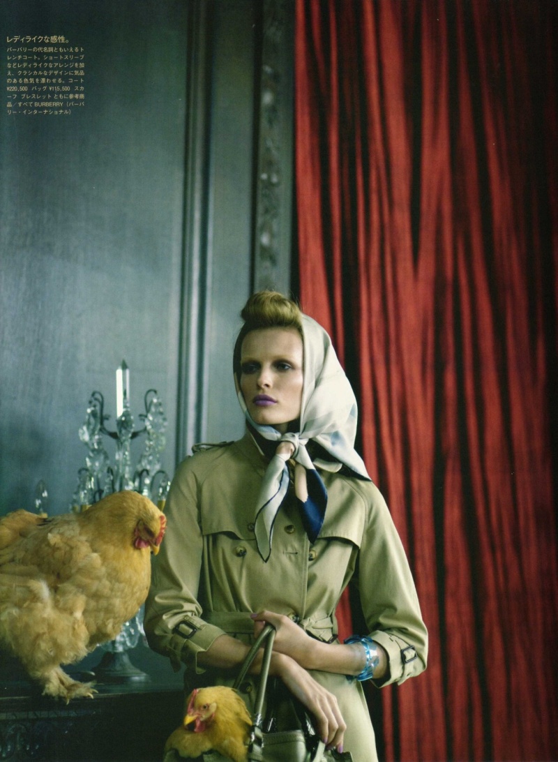 Edita Vilkeviciute poses in country clothing with a chicken in Vogue Nippon