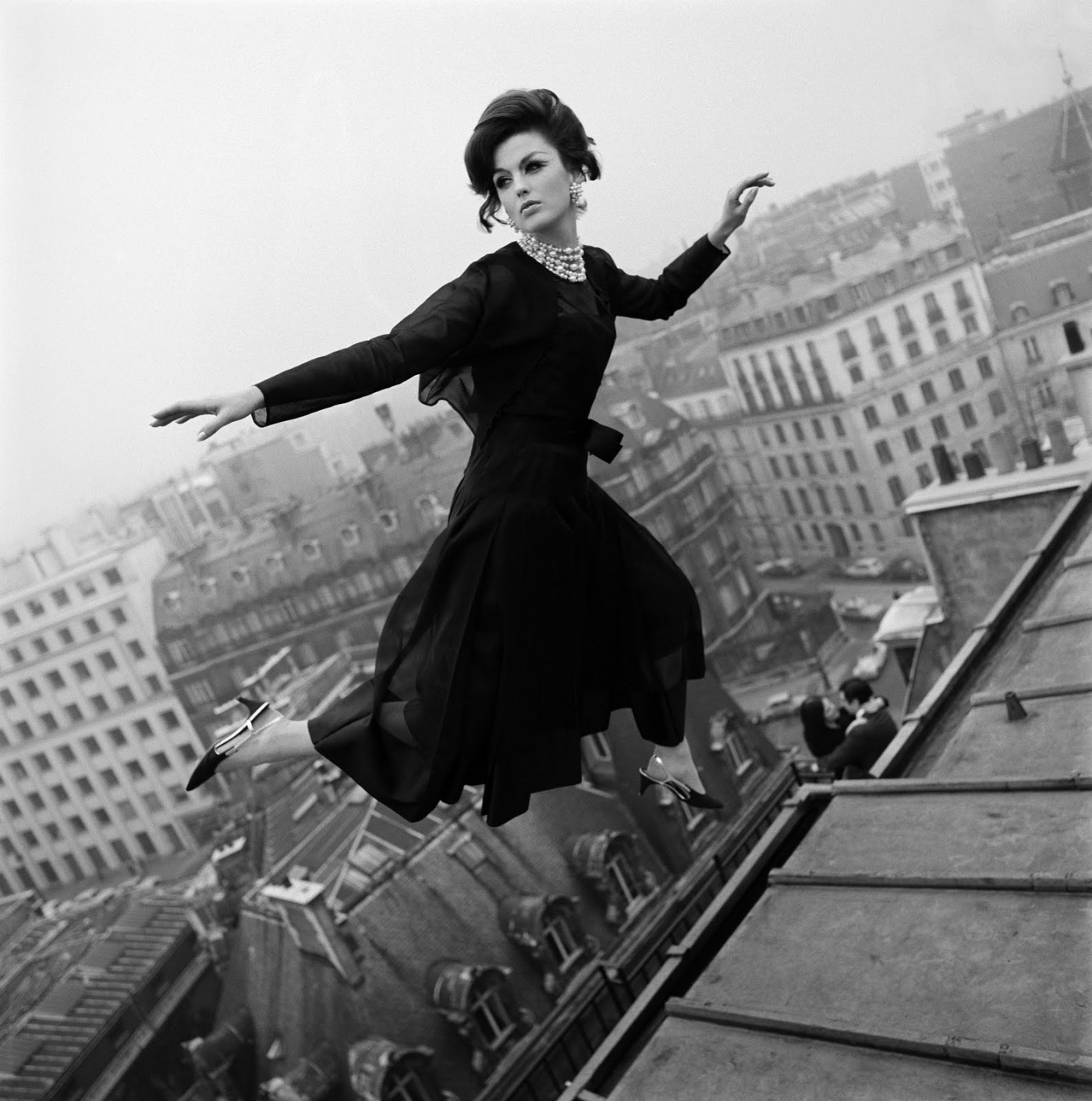 woman flying over cityscape in 1965