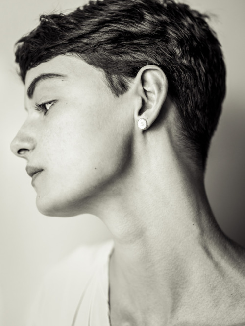 woman with short dark hair in profile